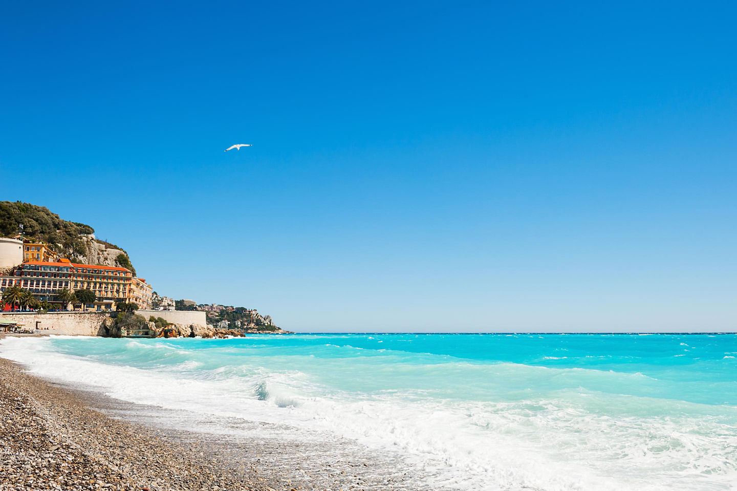 Nice’s pebble beaches and beach clubs offer relaxing seaside days, dining and iconic summer charm. - Nice, France