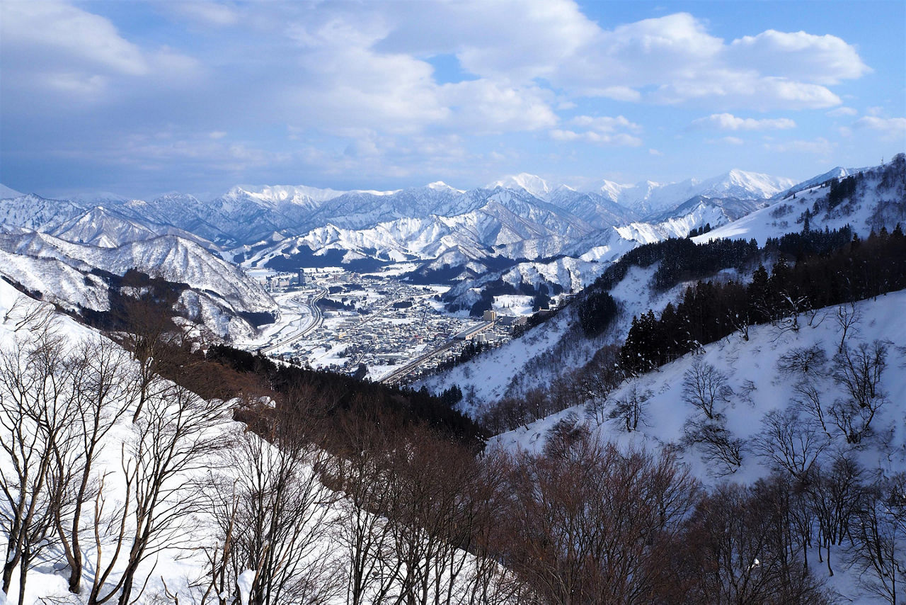 View of the snow mountain range from a gondola during Winter in Niigata, Japan