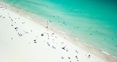 An aerial viw of Leighton Beach with lots of beach goers enjoying the day in Perth