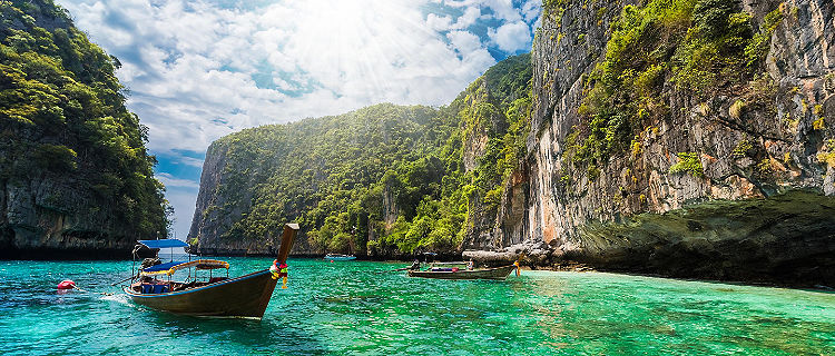 Beautiful landscape with traditional boat on the sea in Phi Phi Lee region in Phuket, Thailand