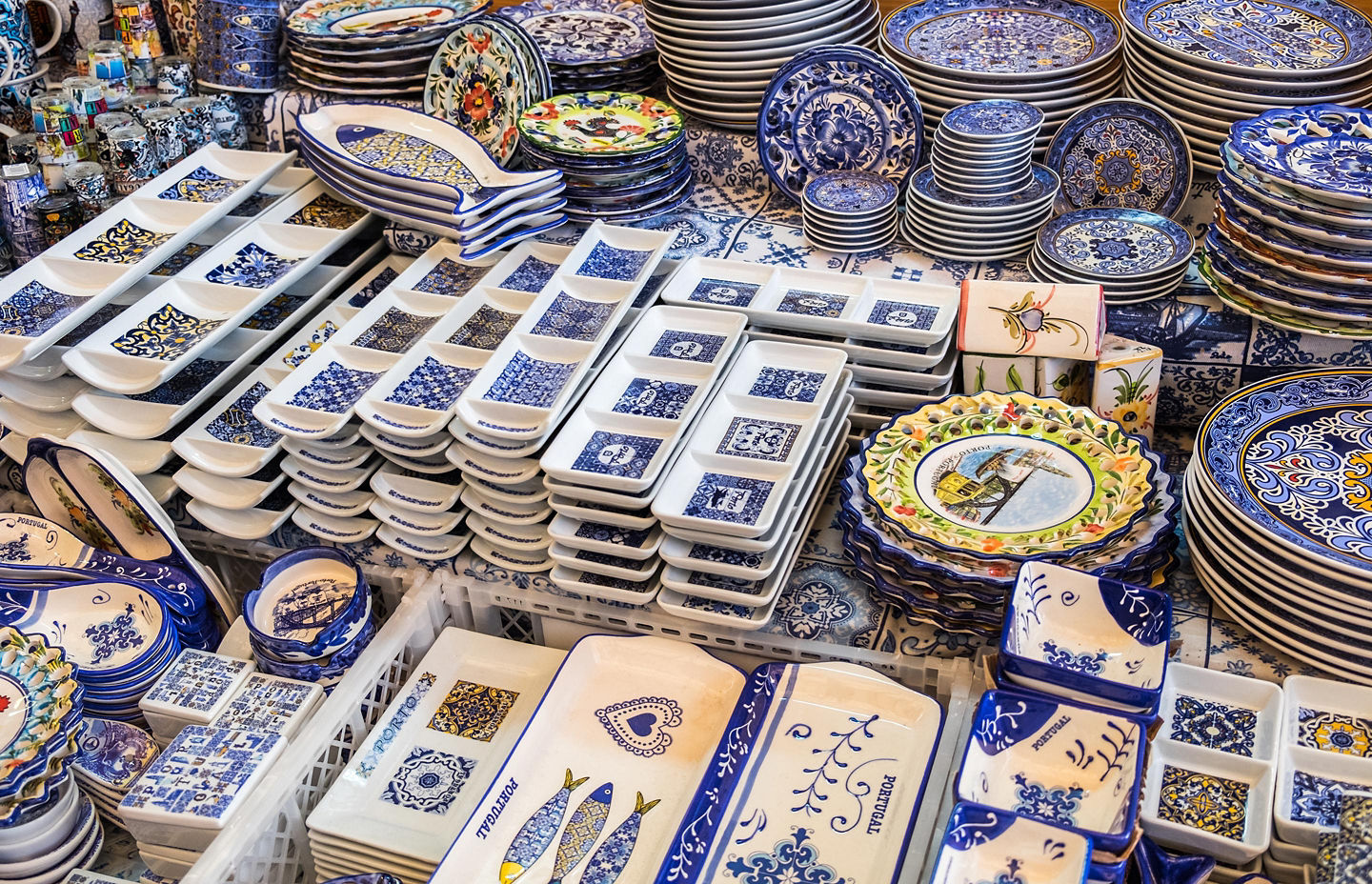 Ceramics blend traditional motifs and modern design, offering colorful, heritage-inspired bowls, plates, and pitchers. - Porto, Portugal