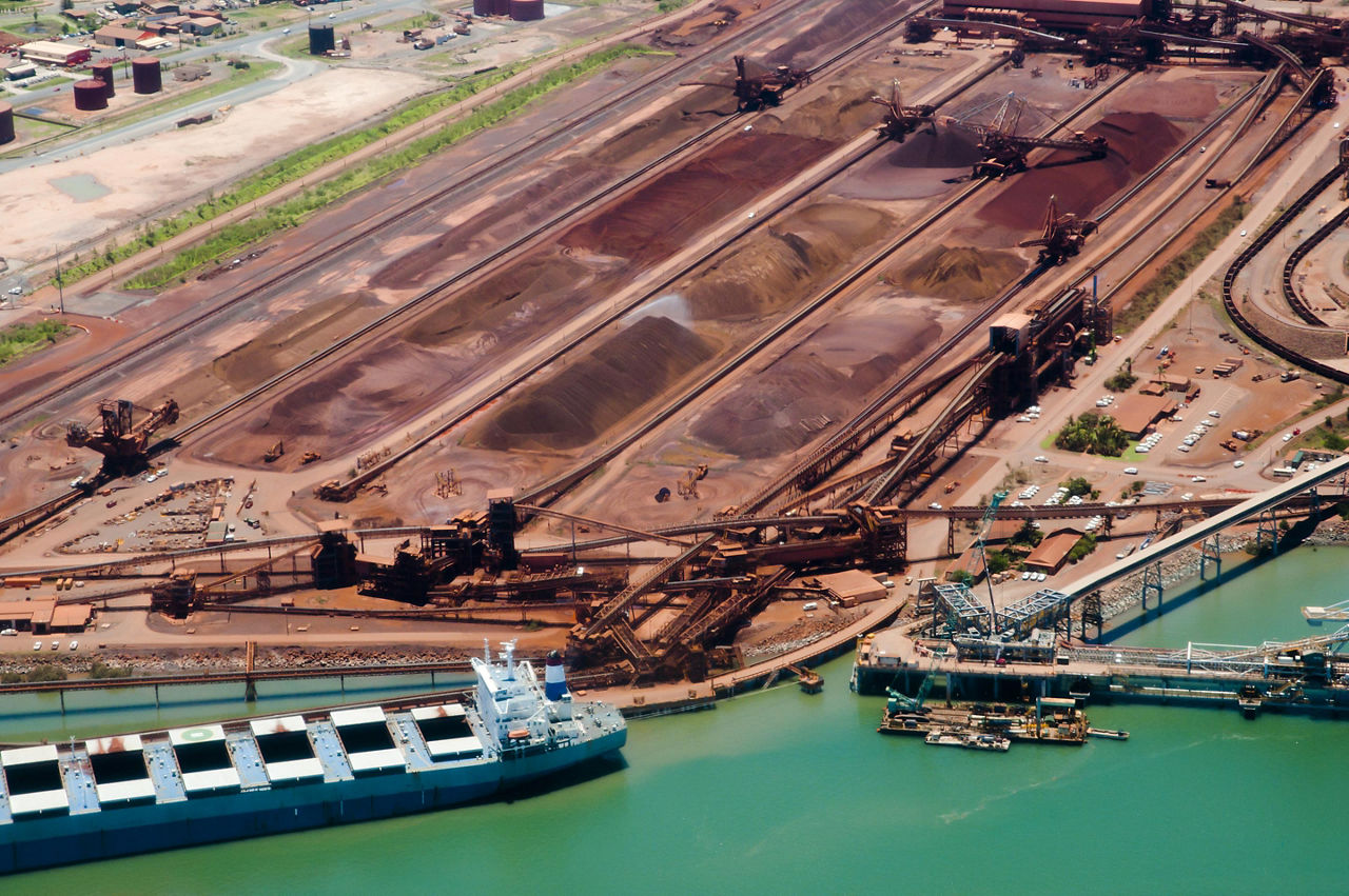 Sand piles and cargo ships at Port Hedland, Australia