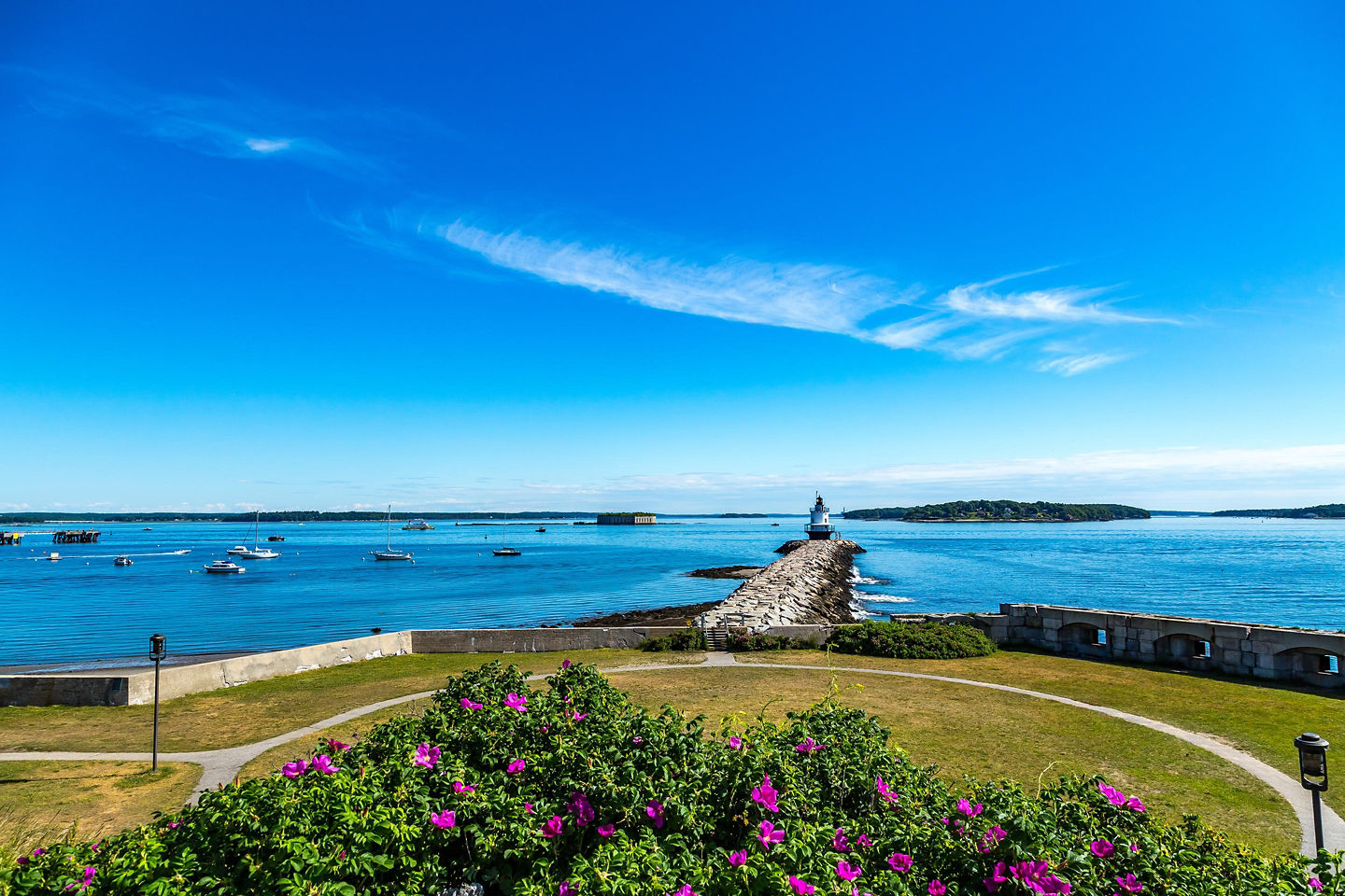 Spring Point Ledge Lighthouse stands on a stone breakwater overlooking Casco Bay. - Portland, Maine