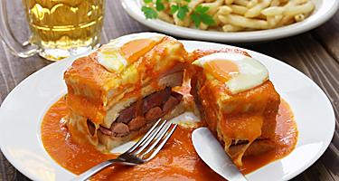 Homemade francesinha, sandwich with ham and sausage, from a restaurant in Porto, Portugal