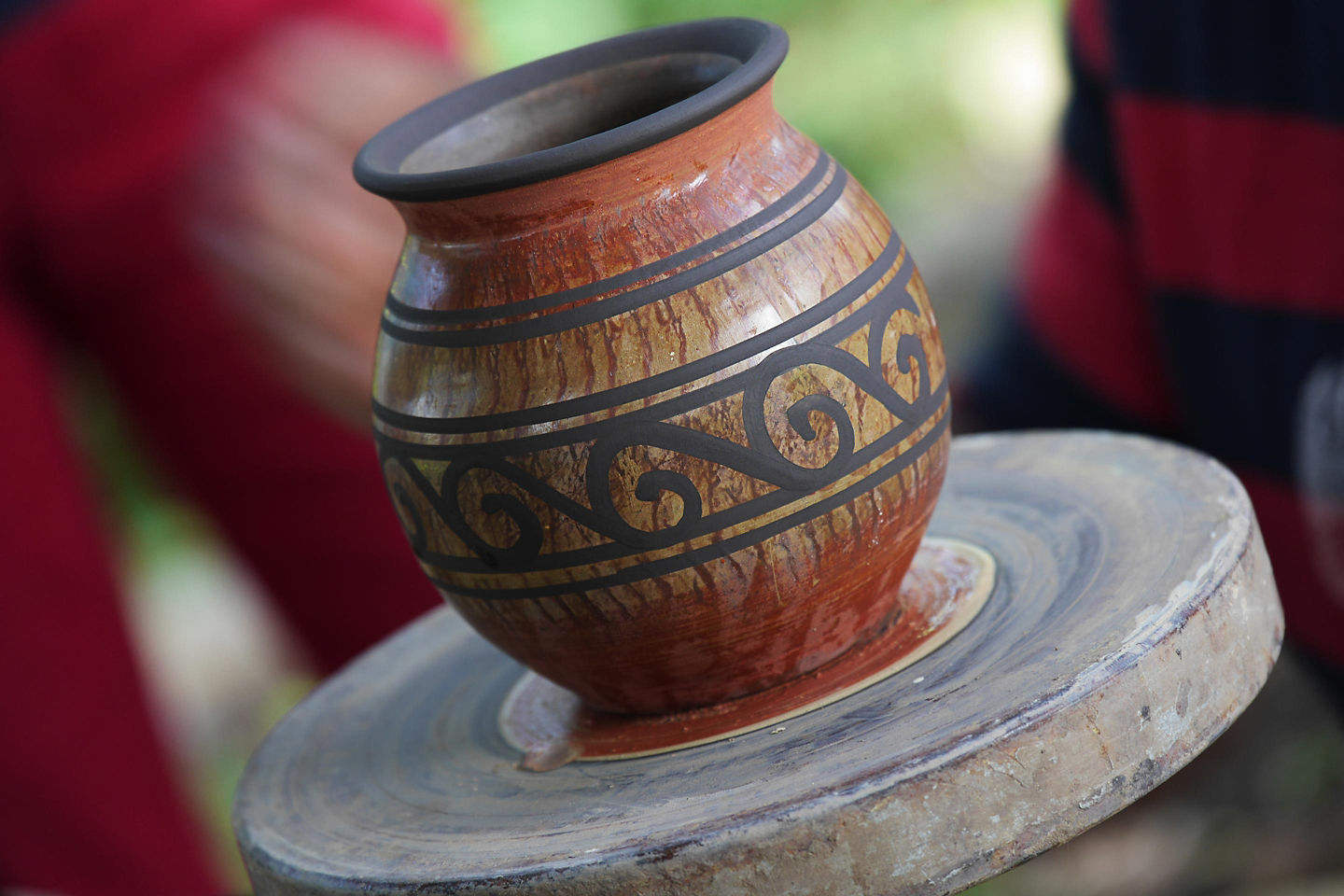 A handcrafted clay vase from Puerto Limón displays earthy tones and traditional Costa Rican design. - Puerto Limón, Costa Rica