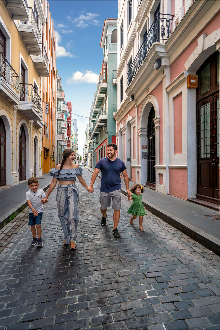 family walking cobblestone streets san juan puerto rico