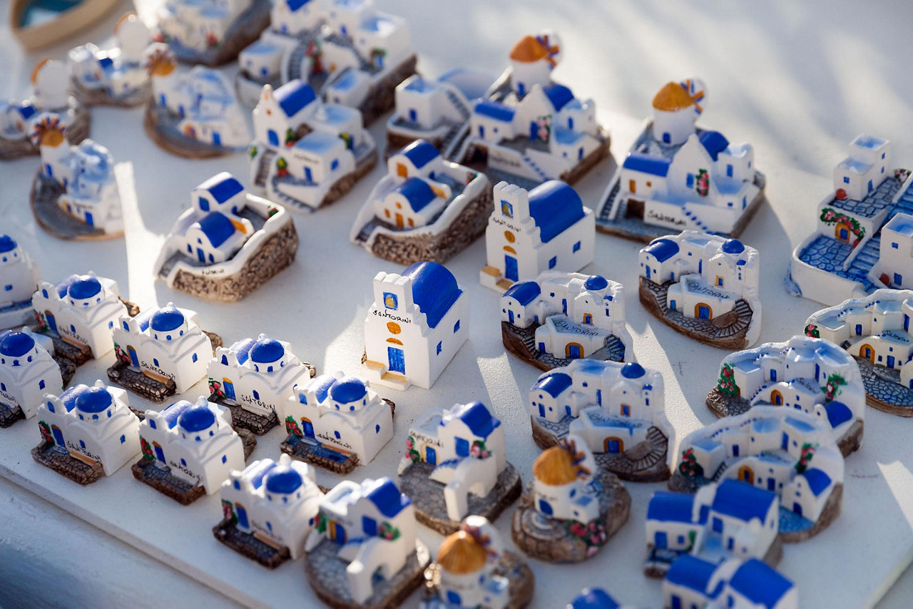 Small white and blue house souvenirs in Santorini, Greece