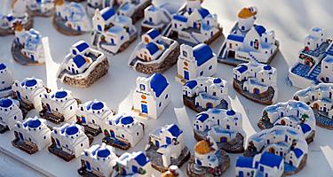 Small white and blue house souvenirs in Santorini, Greece