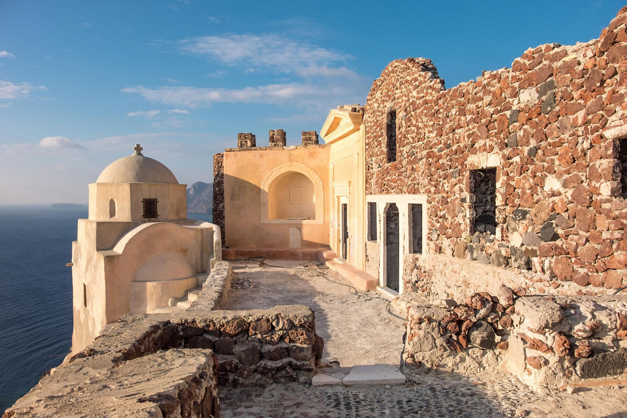 Early morning in Byzantine Castle Ruins in Oia village, Santorini, Greece