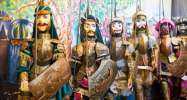 Various sicilian puppets at a market