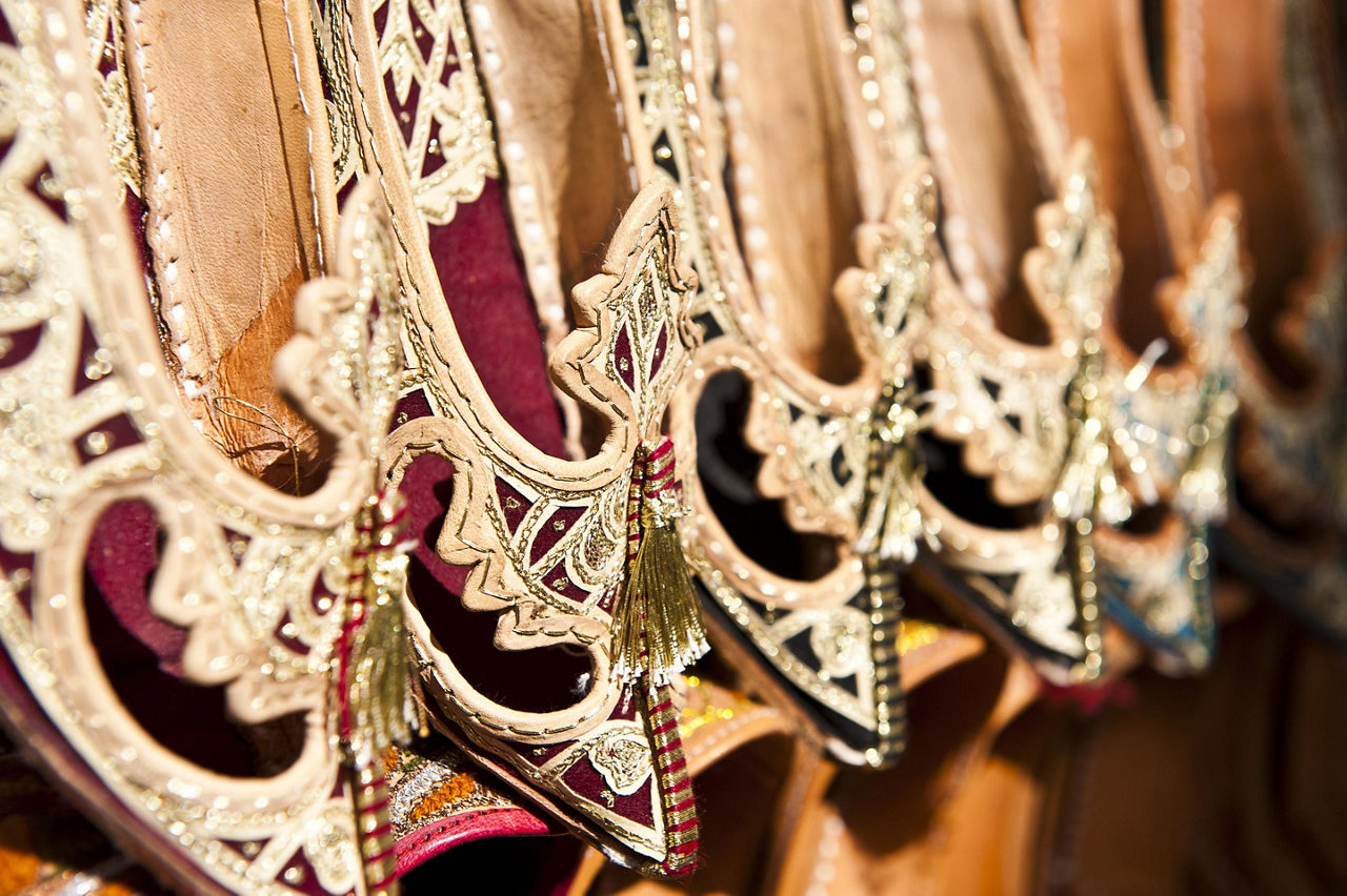 Rows of typical oriental shoes at a market in Sir Bani Yas, United Arab Emirates
