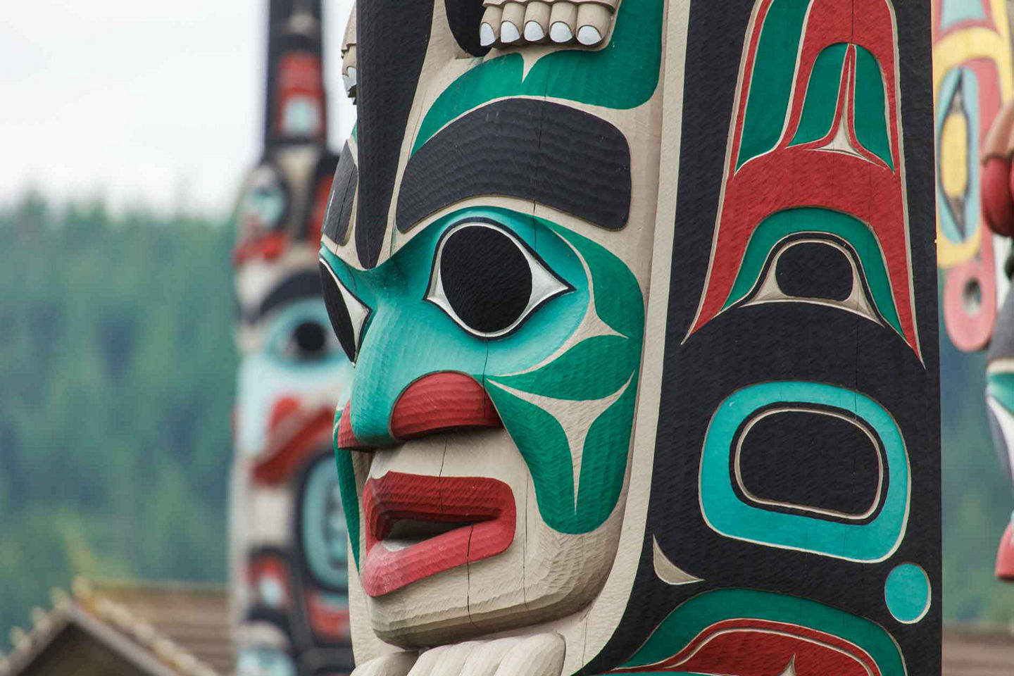 Local artists showcase handcrafted totems and artwork in vibrant Sitka marketplace. - Sitka, Alaska