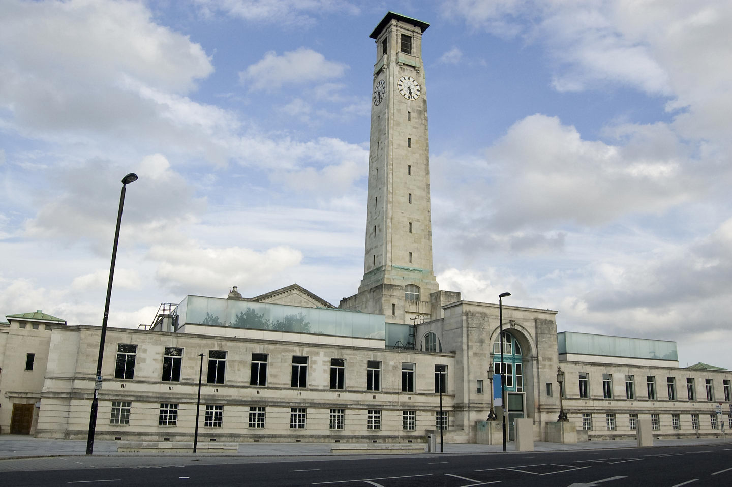 Modern SeaCity Museum exterior framed by bright sky and surrounding buildings. - Southampton, England