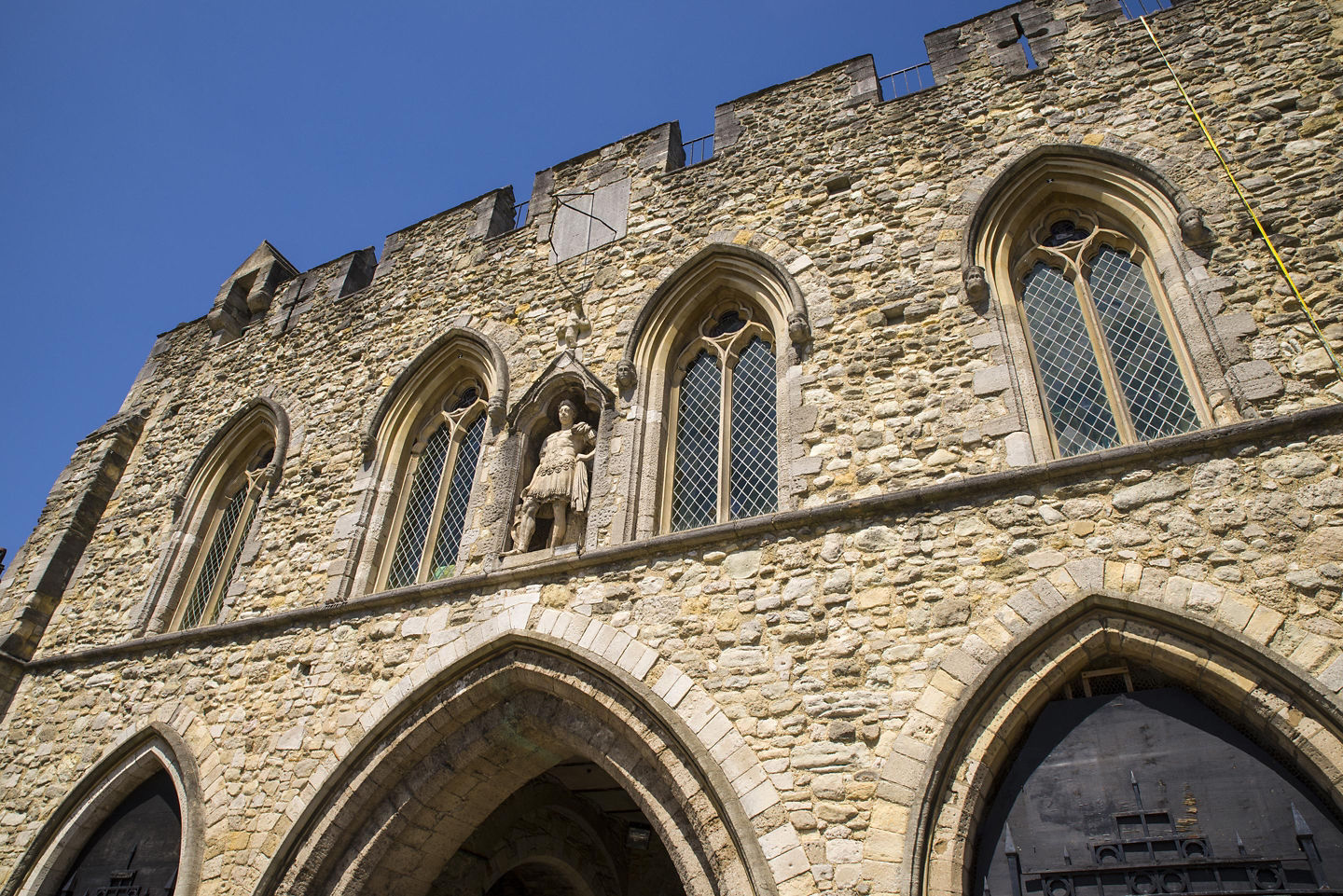 Historic Bargate stone arch rising above Southampton’s bustling city walkway. - Southampton, England