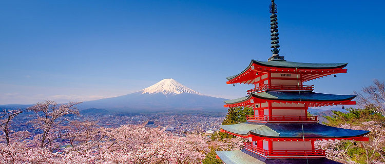 The upper levels of Chureito Red Pagoda with Mount Fuji in the distance
