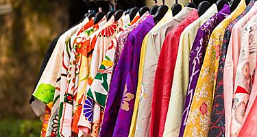 An assortment of kimonos on a rack in Japan