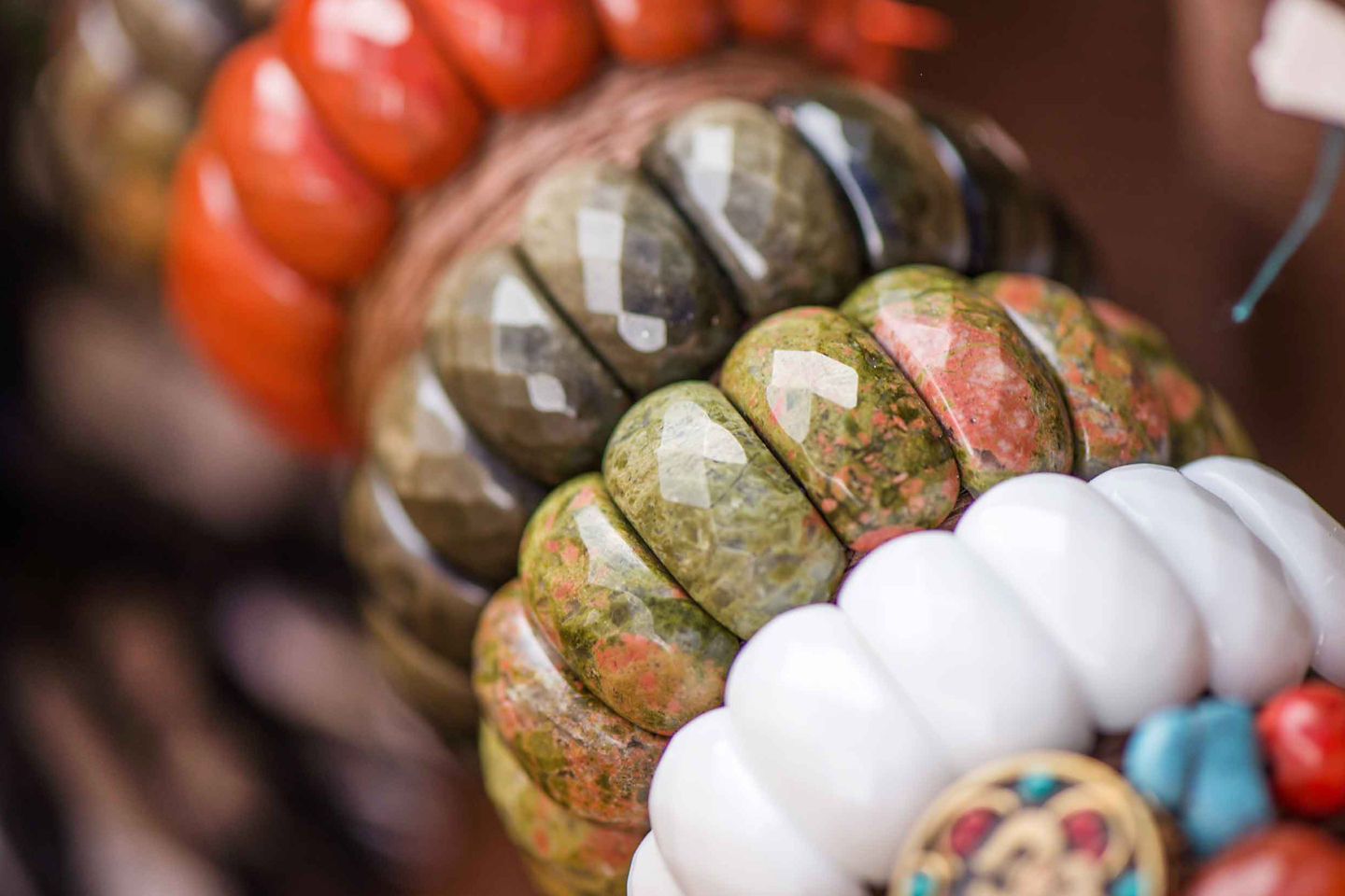 Colorful handmade bracelets from Tortola are displayed together, showcasing local Caribbean craftwork. - Tortola, British Virgin Islands 