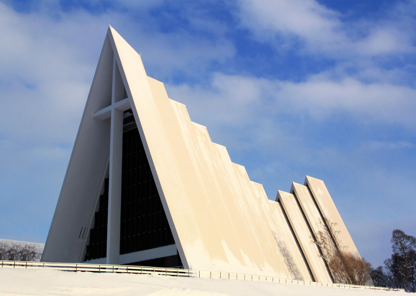 Arctic Cathedral’s sharp white façade glows against Tromsø’s bright northern sky. - Tromsø, Norway