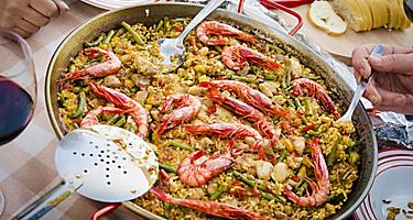 A Valencian paella being served