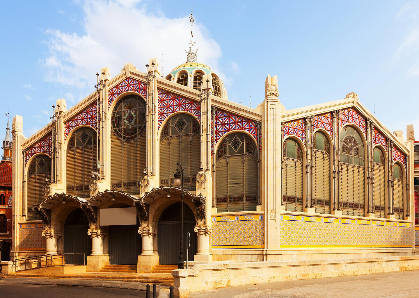 Shoppers can be found browsing colorful produce and stalls inside Valencia’s bustling Central Market hall. - Valencia, Spain
