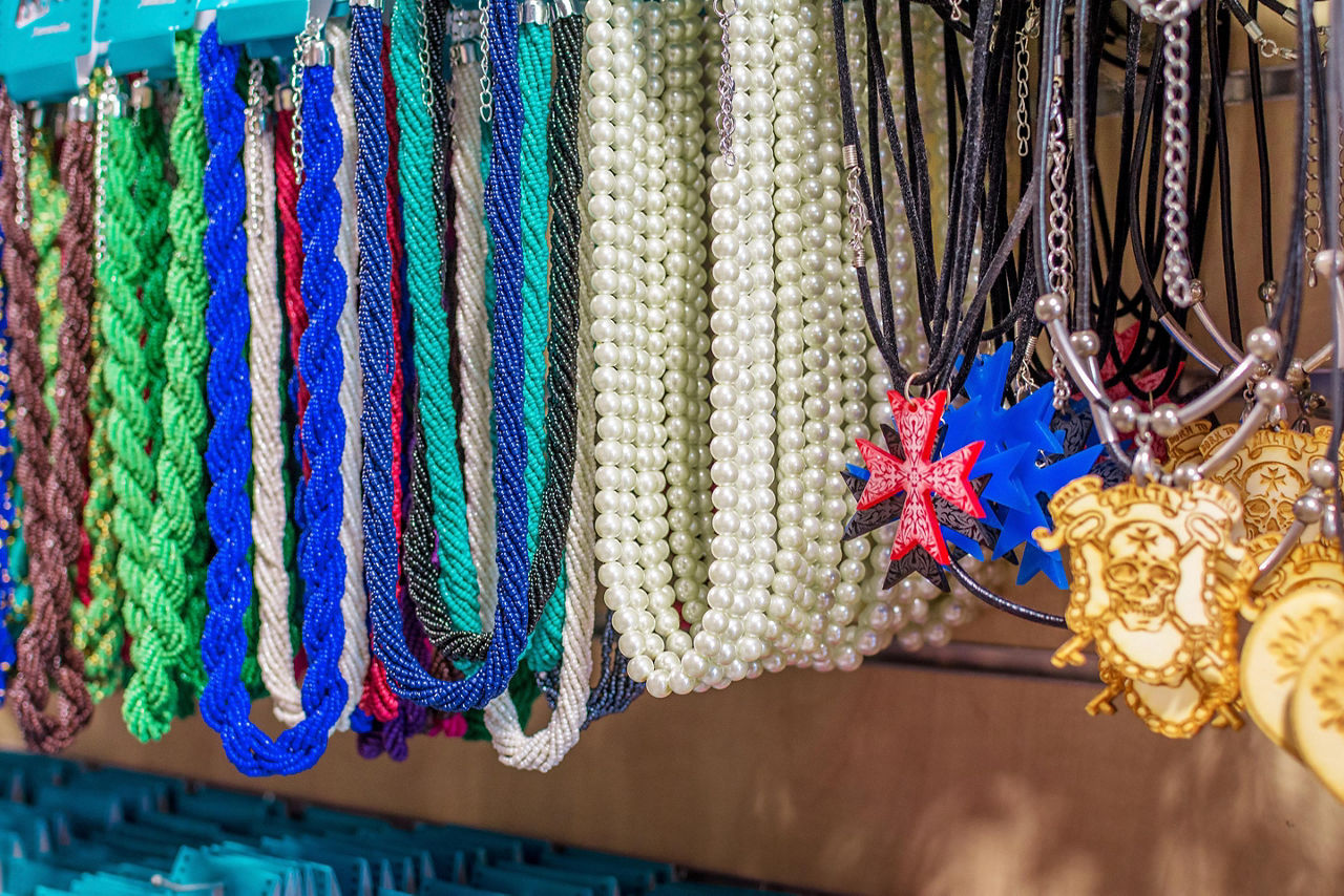 An assortment of souvenir necklaces