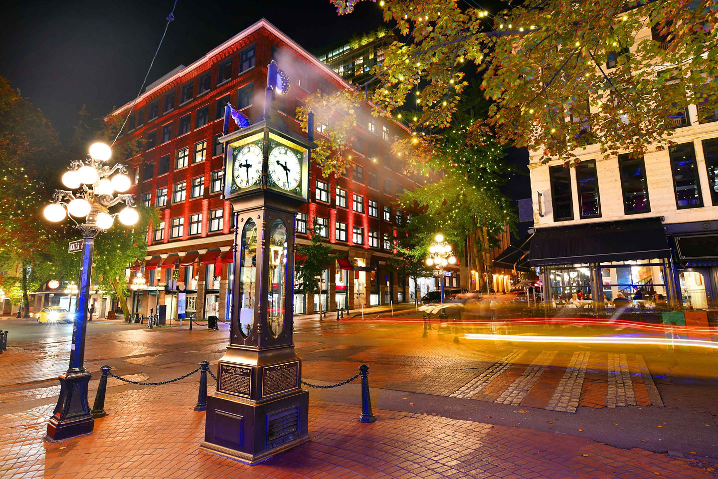 Historic Gastown buildings line cobblestone square. - Vancouver, British Columbia