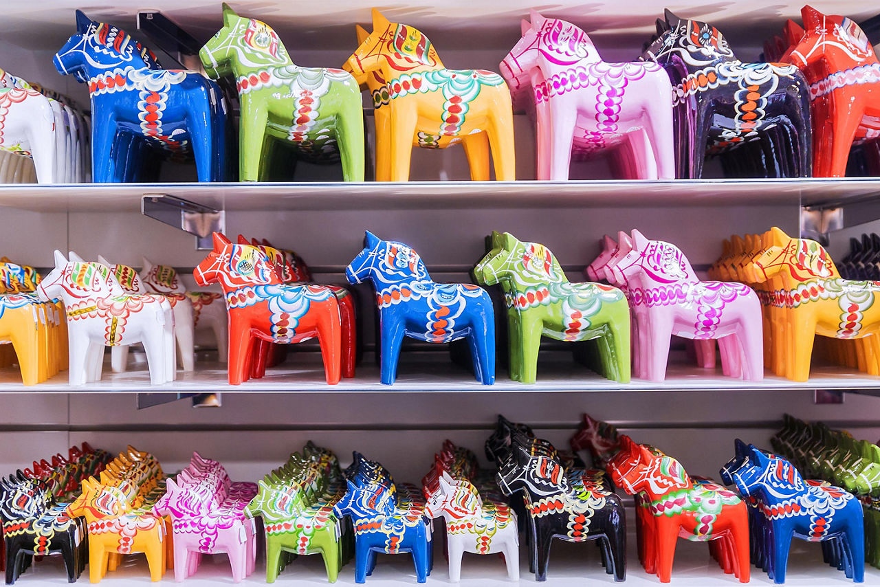 A variety of colorful miniature horse souvenirs