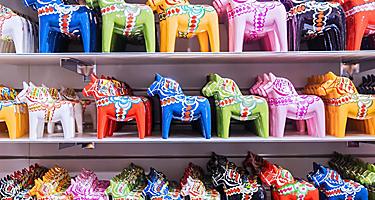 A variety of colorful miniature horse souvenirs
