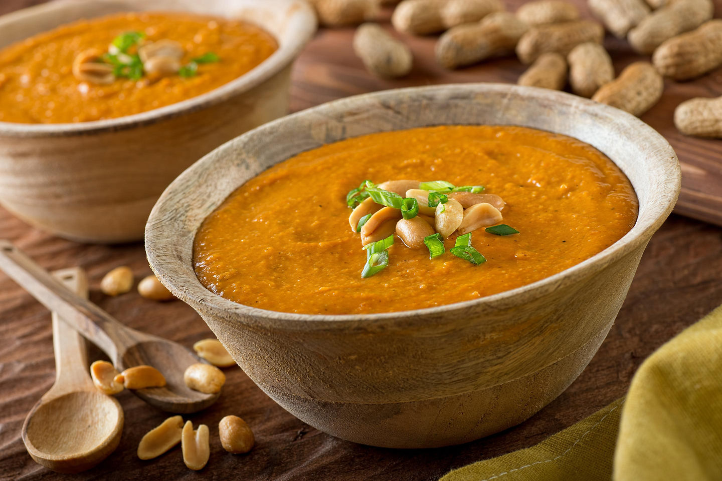 A bowl of Curaçao peanut soup shows its creamy texture, topped with herbs for garnish. - Willemstad, Curaçao