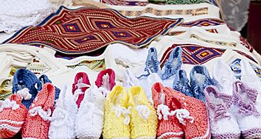 Table cloths and knit goods at a street market in Croatia