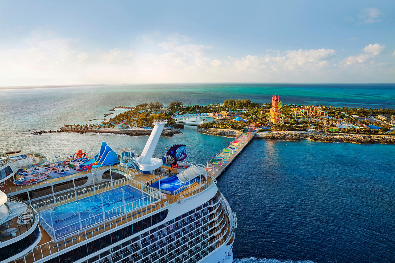 WN, Wonder of the Seas, aerial, Perfect Day at CocoCay, broad view of the island with Daredevil's Peak in distance, ship docked, pier, ocean horizon,