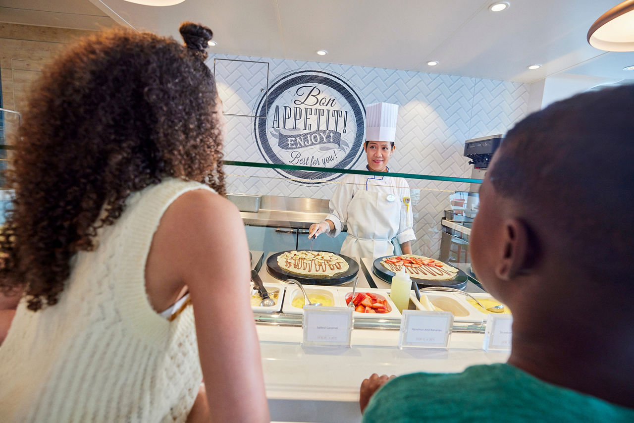 Mother and Son Getting a Crepe at AquaDome Market