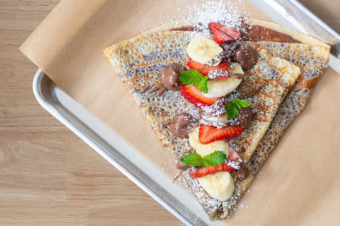 Crêpes are a Parisian favorite, enjoyed sweet or savory from street vendors or cozy crêperies. - Paris (Le Havre), France