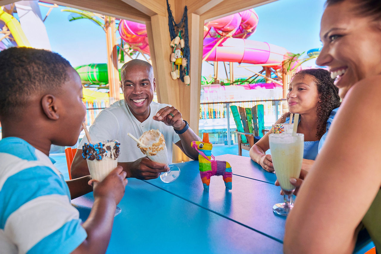 Family Enjoying Milkshakes at Basecamp
