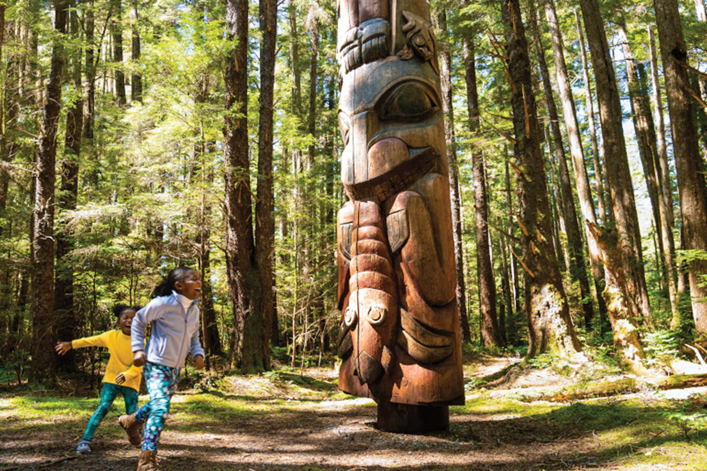 Kids explore Sitka National Historical Park totem trail. - Sitka, Alaska