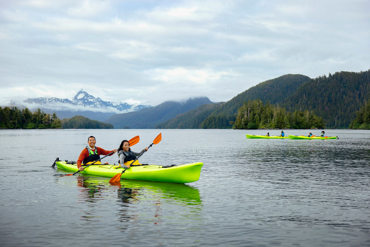 Couple in green kayak, Sitka, Alaska