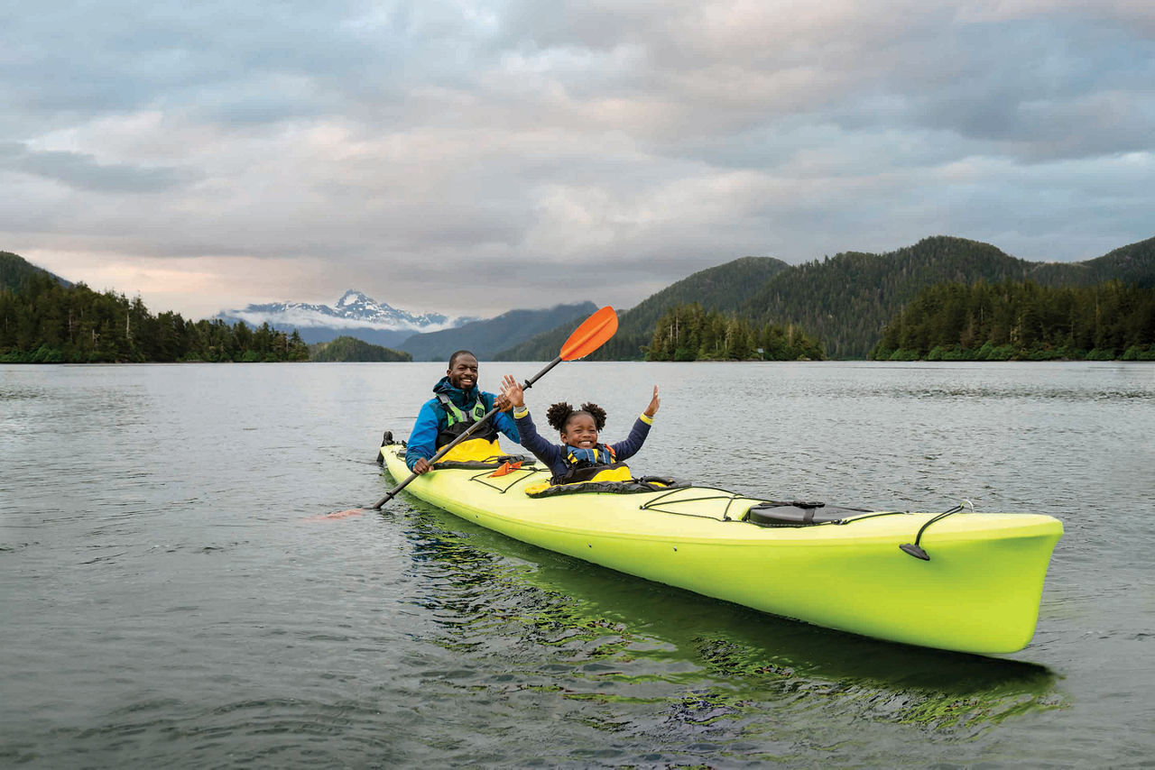 Father and daughter in green kayak, Sitka, Alaska