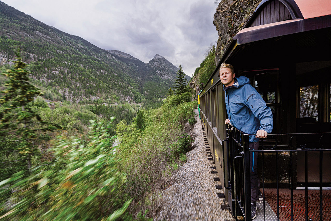 Man standing on Skagway Train, Alaska