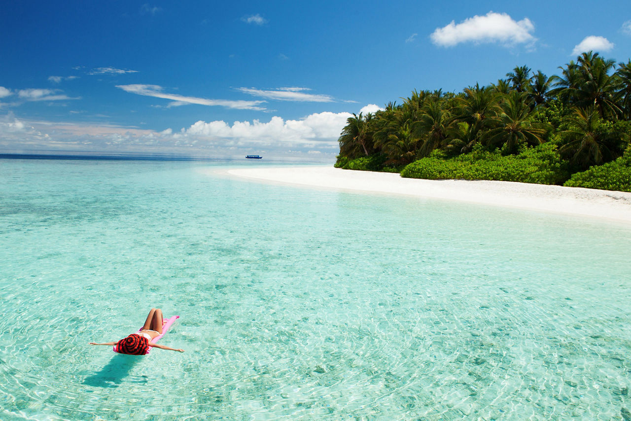Maldives Islands Woman Relaxing in the Ocean