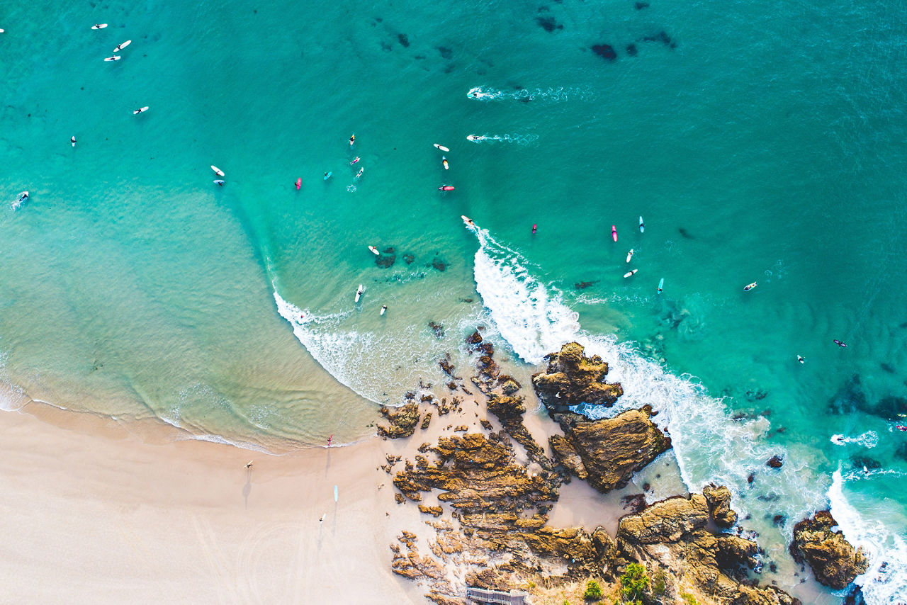 Aerial View of Surfers waiting for Best Surfing Waves in Byron Bay, Australia.
