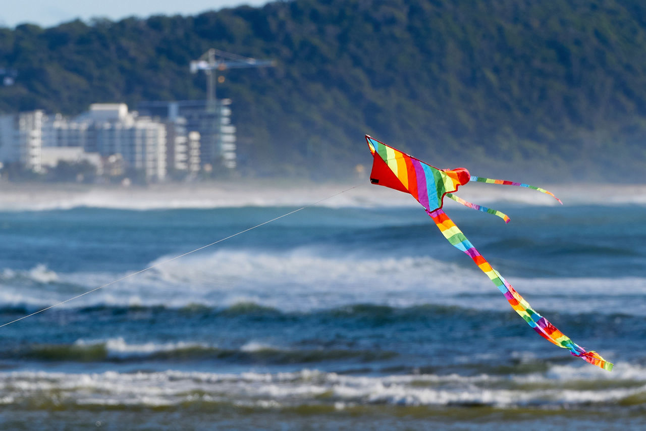 Rainbow kite flying at an Austrailian  beach. Australia