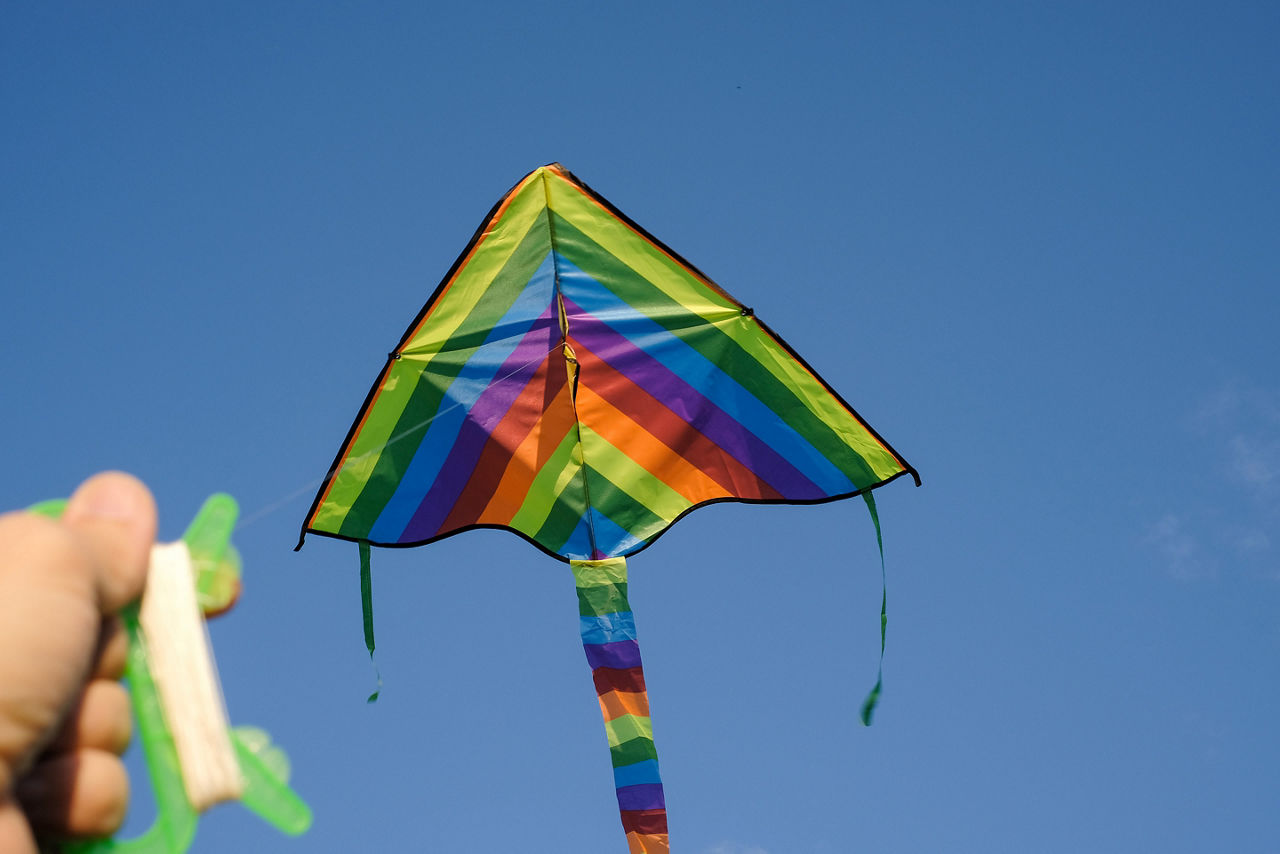Vacation traveler flying kite high in the Australian sky. Australia