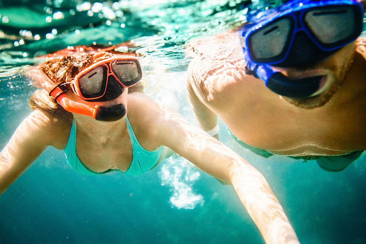 Couple Snorkeling Underwater