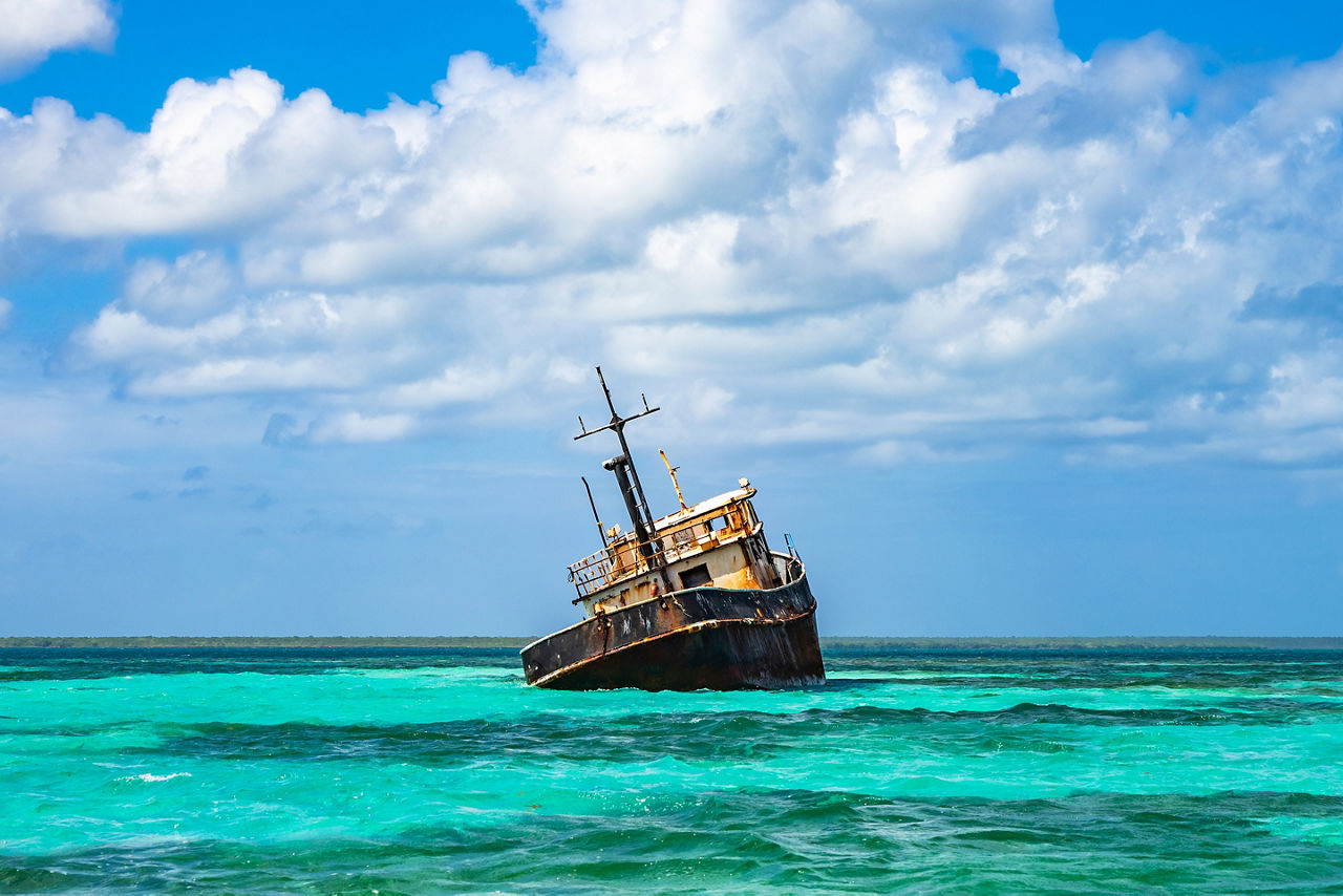 Old abandoned naval boat in the caribbean.