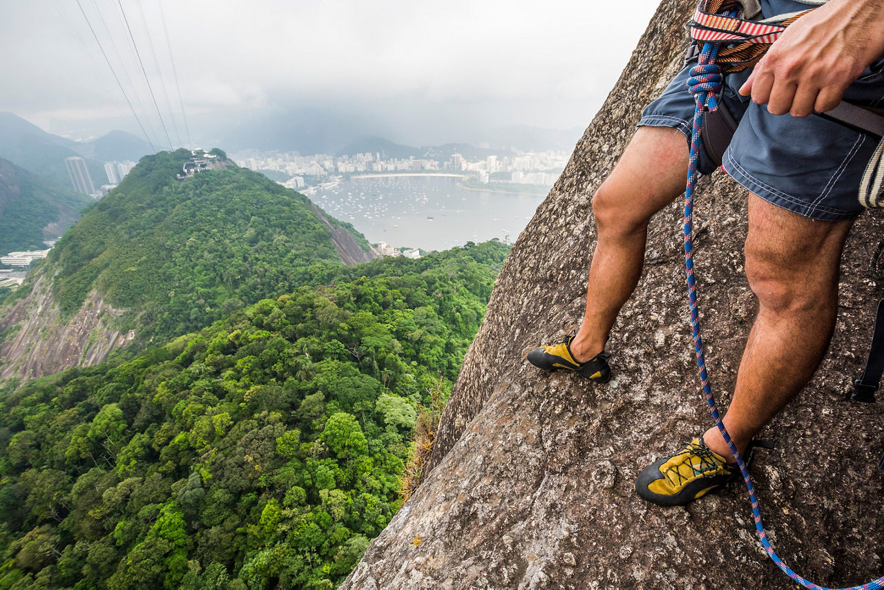 Man rock climbing in Pao de Acucar Mountain, Rio de Janeiro. Brazil.