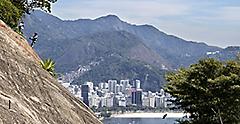 Vacation travelers climbing the rocks at Rio de Janeiro on Sugarloaf Mountain. Brazil.