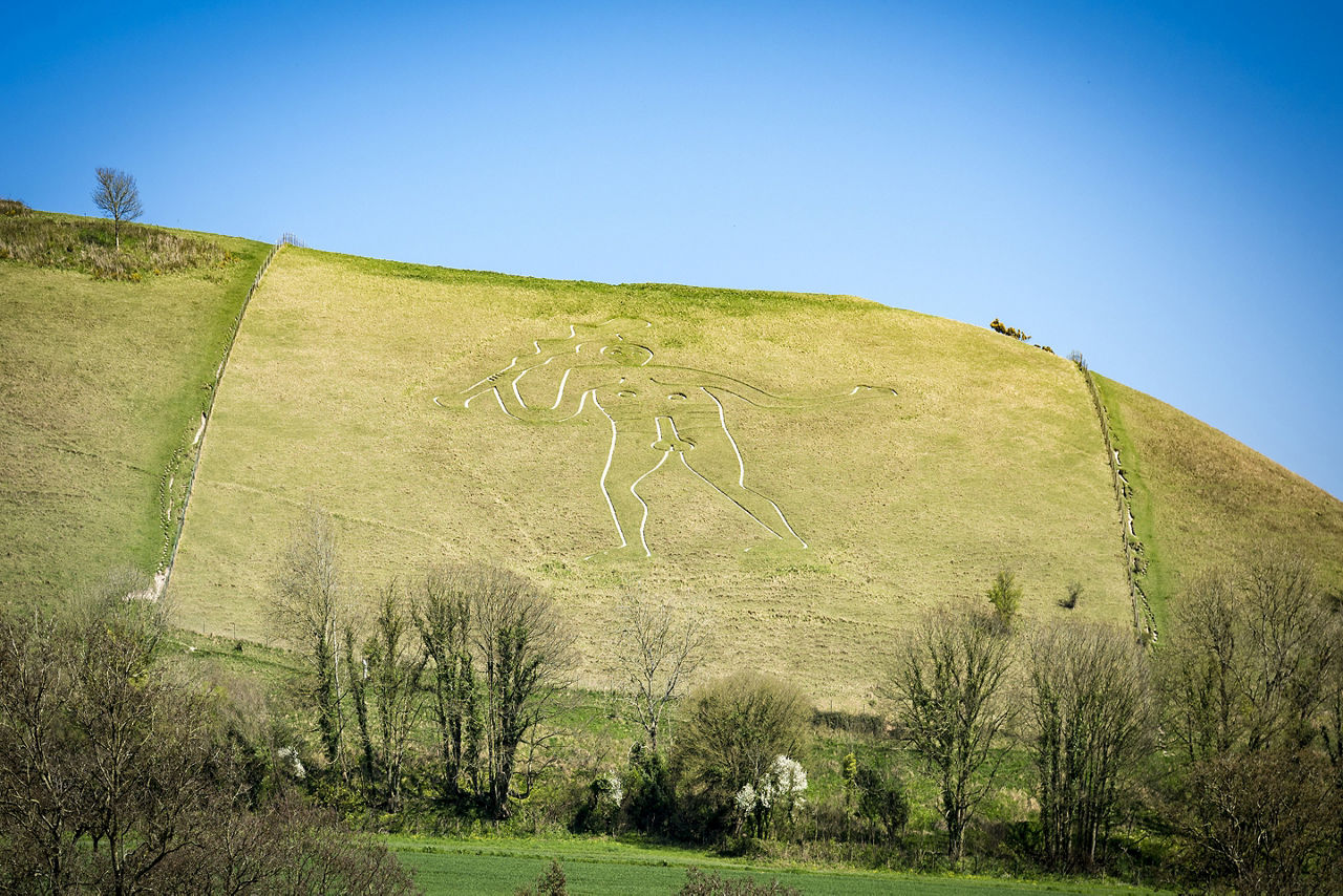 Visiting the famous chalk figure landmark of the Cerne Abbas Giant in Dorset. British Isles.