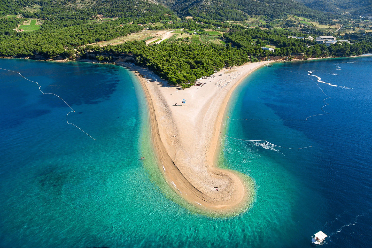Zlatni Rat’s bright sandbar stretches into clear Adriatic waters. - Brac, Croatia