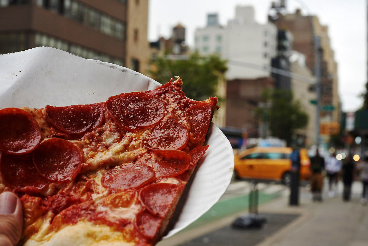 Pizza sold by the Slice in NYC that is made with NY water, New York.