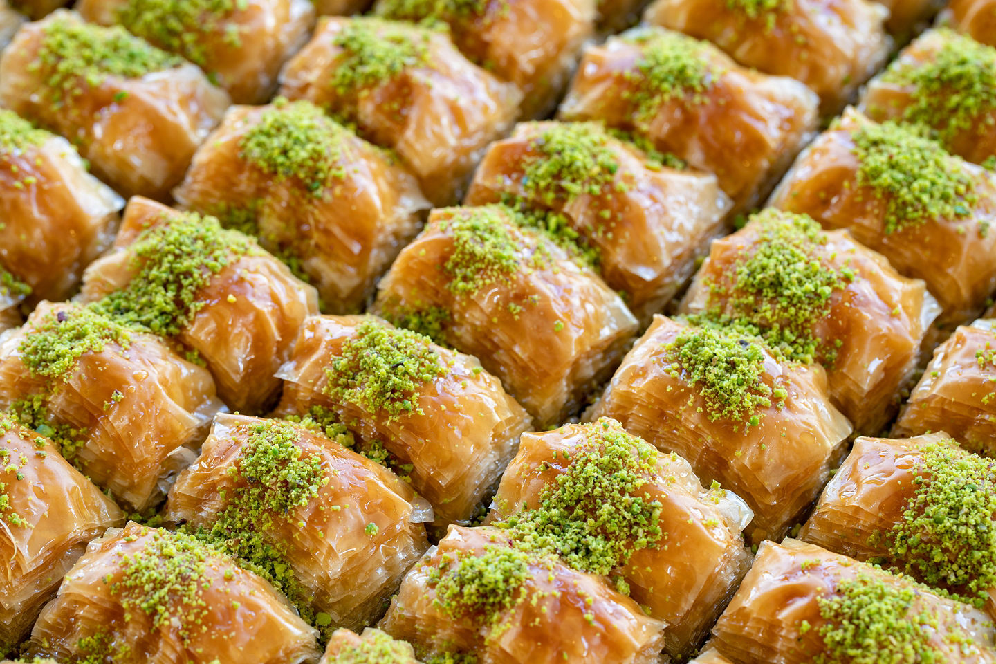 Baklava is Istanbul’s signature sweet: crispy, nut-filled layers soaked in honeyed syrup for indulgent perfection. - Istanbul, Turkey